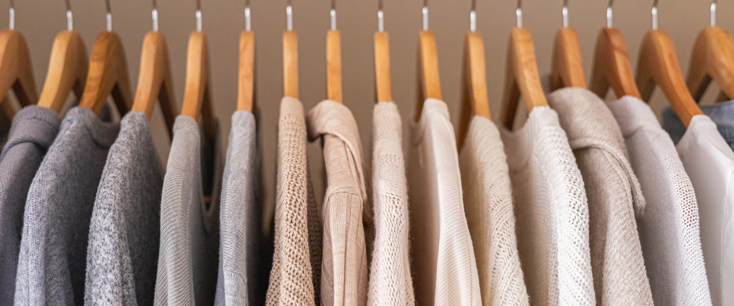 Neatly organized wardrobe with wooden hangers